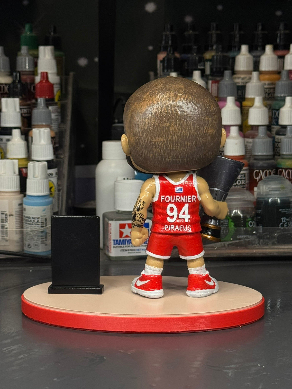 Evan Fournier hand-painted basketball figure, back view showing number 94 and display base