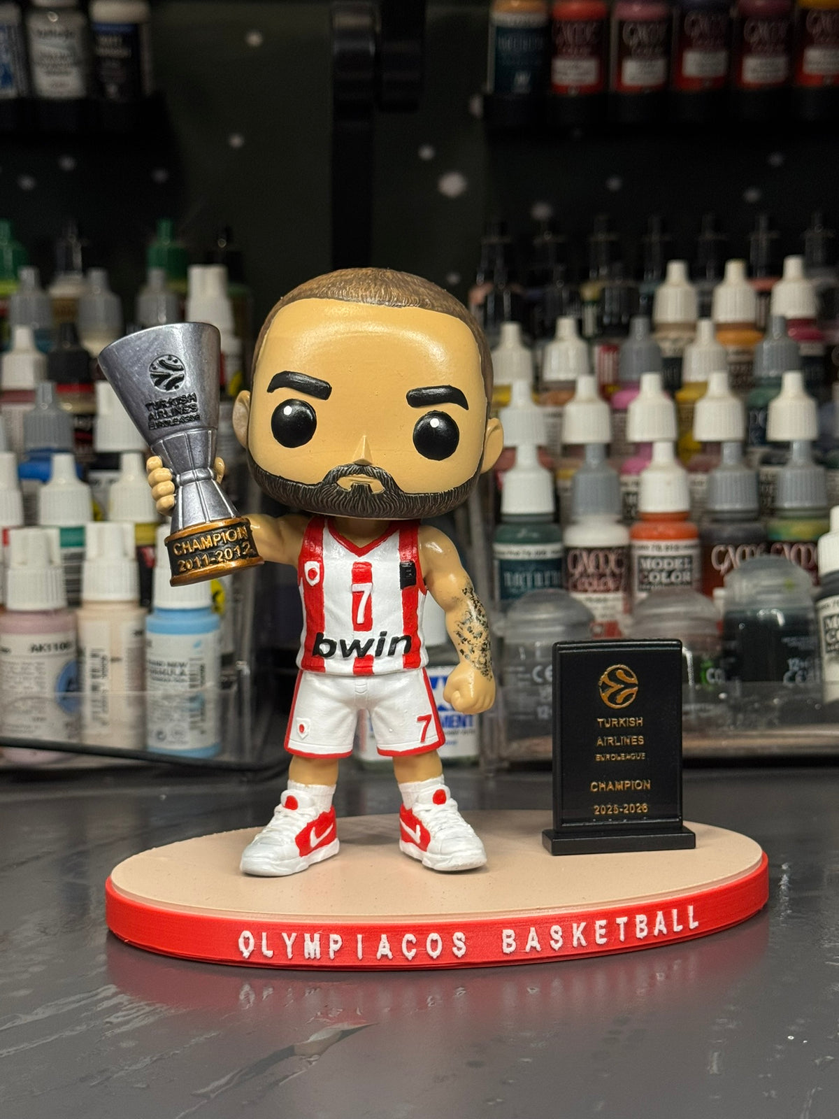 Vassilis Spanoulis hand-painted 15 cm basketball collectible figure, front view with trophy and display base
